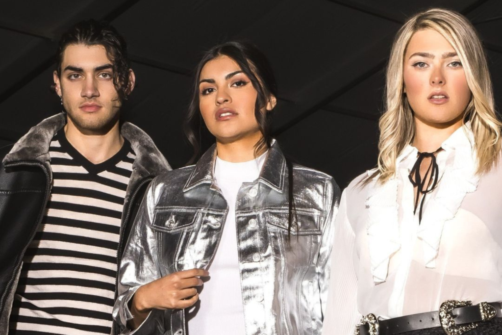 zade nassar rocio Valenzuela and pascale bushaw side by side wearing black and white posing for fabulous arizona Arizona fashion week collection of the year at Barrett-Jackson Scottsdale luxe and city luxe culture